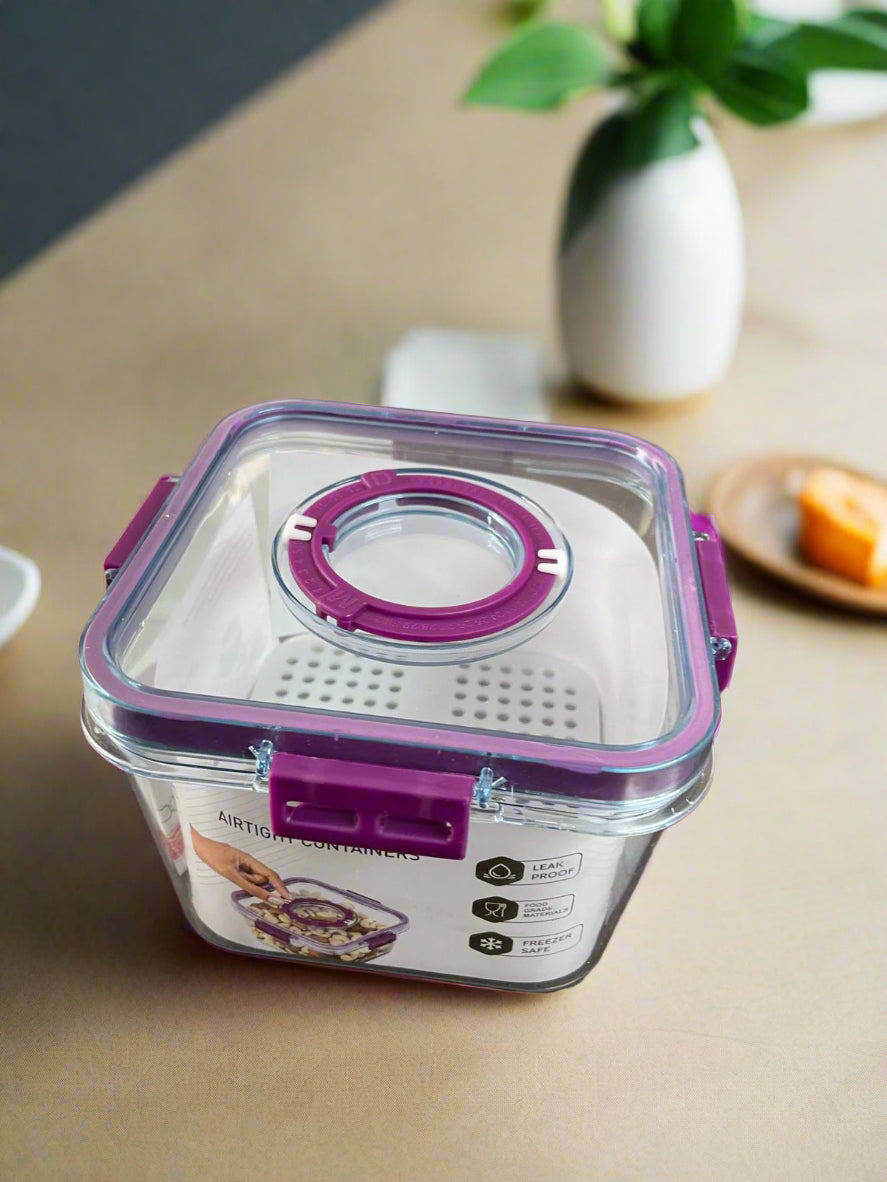 Square food container with purple lid on a wooden surface