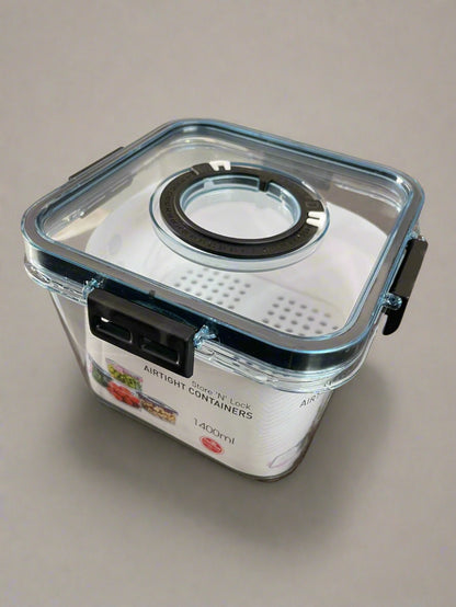 Clear airtight container with black sealing ring on a beige background