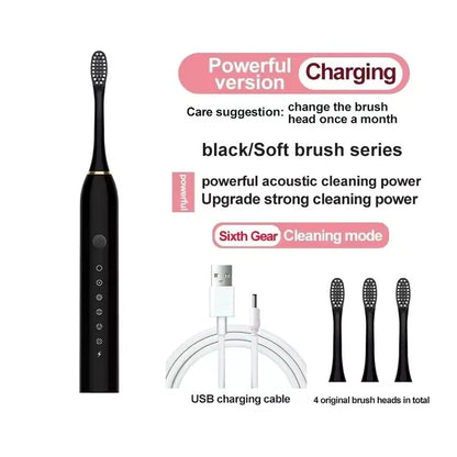 Black electric toothbrush with USB charging cable and brush heads on a white background