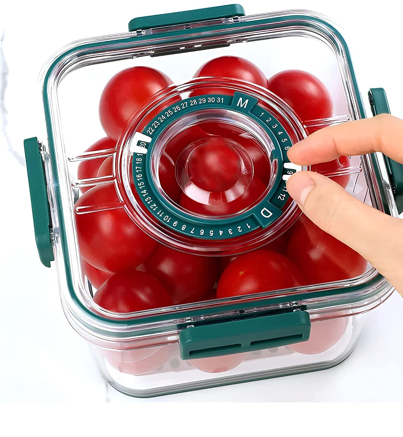 Clear container with red tomatoes and a hand adjusting a dial inside.